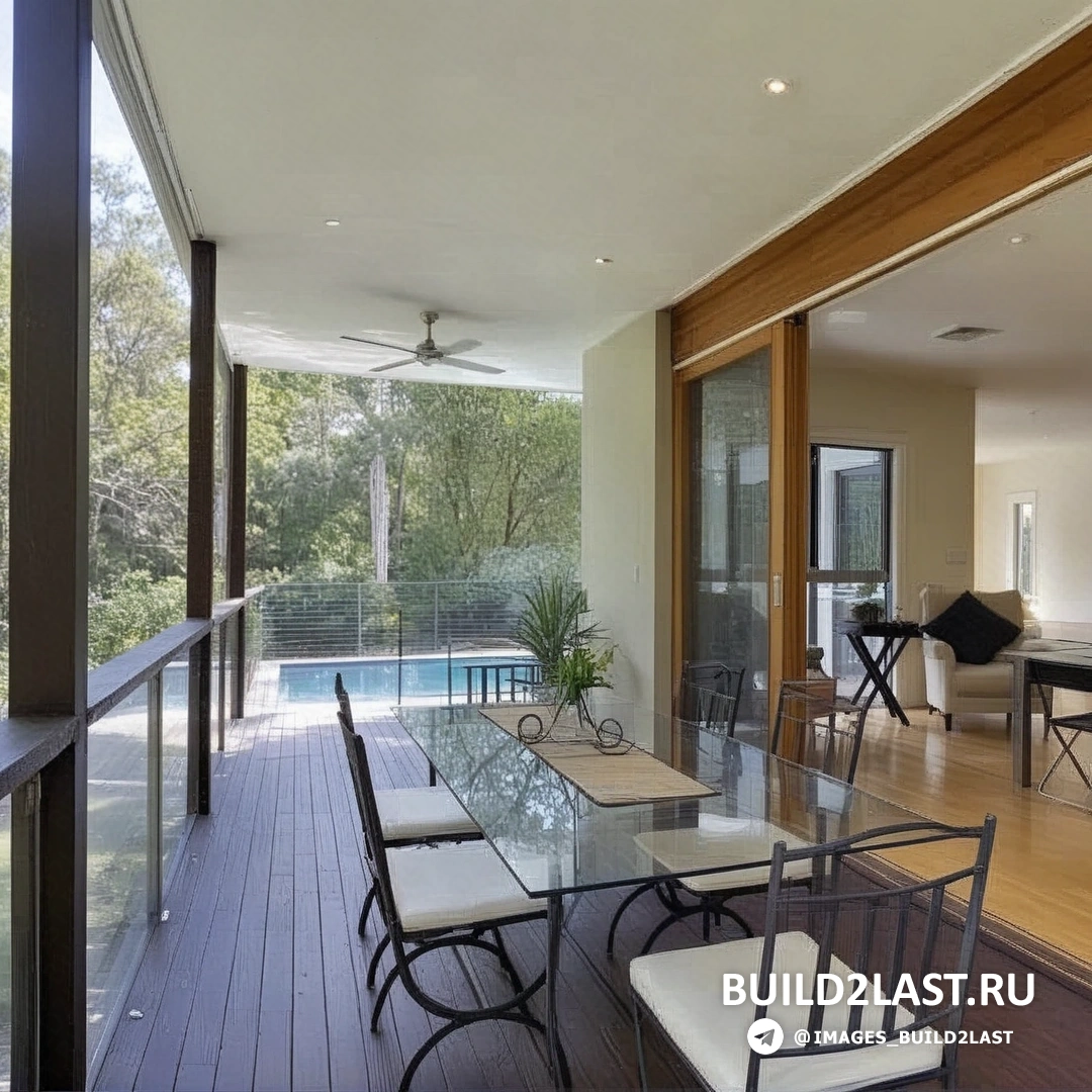 Спальня с большими окнами, минималистичным декором и видами на природу